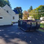 Reed's dumpster in driveway