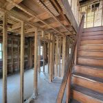 Interior of house with walls and flooring stripped away
