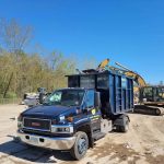 Dumpster truck from Reed's Demolition & Cleanouts LLC