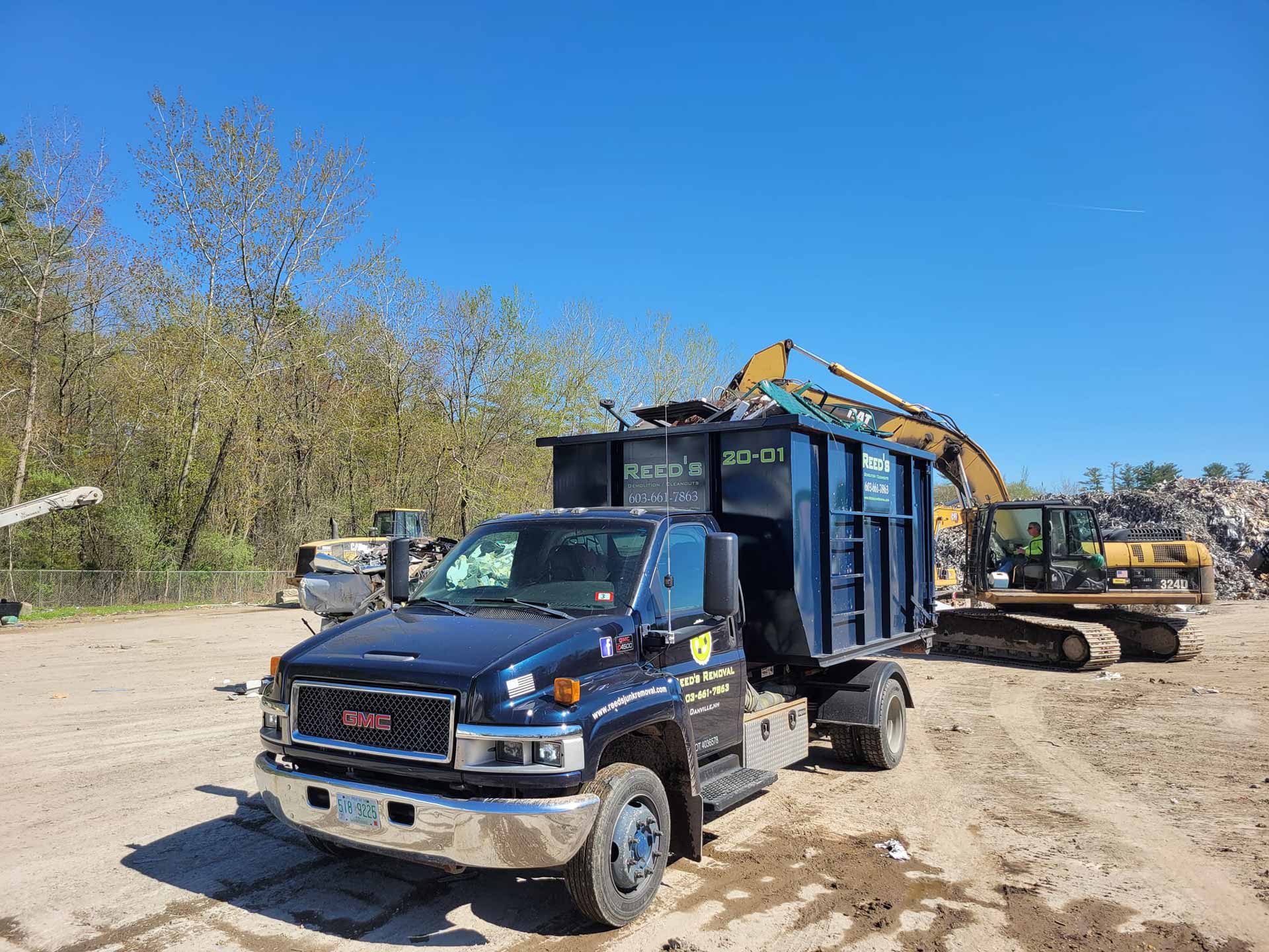 Dumpster truck from Reed's Demolition & Cleanouts LLC