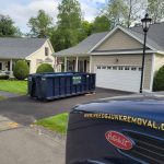 Rental dumpster from Reed's Demolition & Cleanouts LLC in driveway