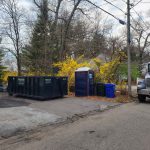 Rental dumpster from Reed's Demolition & Cleanouts LLC in driveway