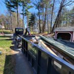 Reed's Demolition & Cleanouts LLC rental dumpster in driveway