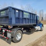 Reed's Demolition & Cleanouts LLC rental dumpster on truck