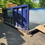 Empty rental dumpster from Reed's Demolition & Cleanouts LLC